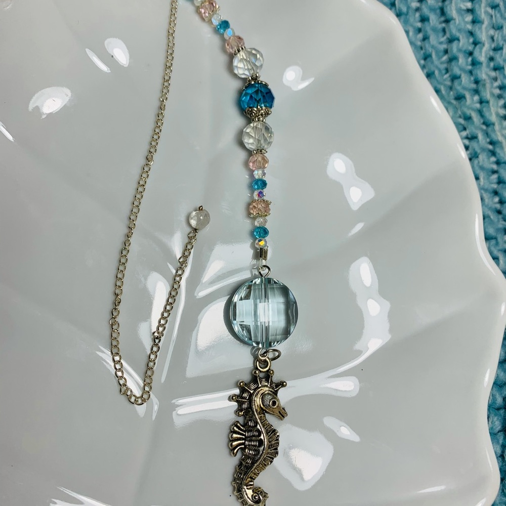 Nautical sun catcher with gorgeous crystals.